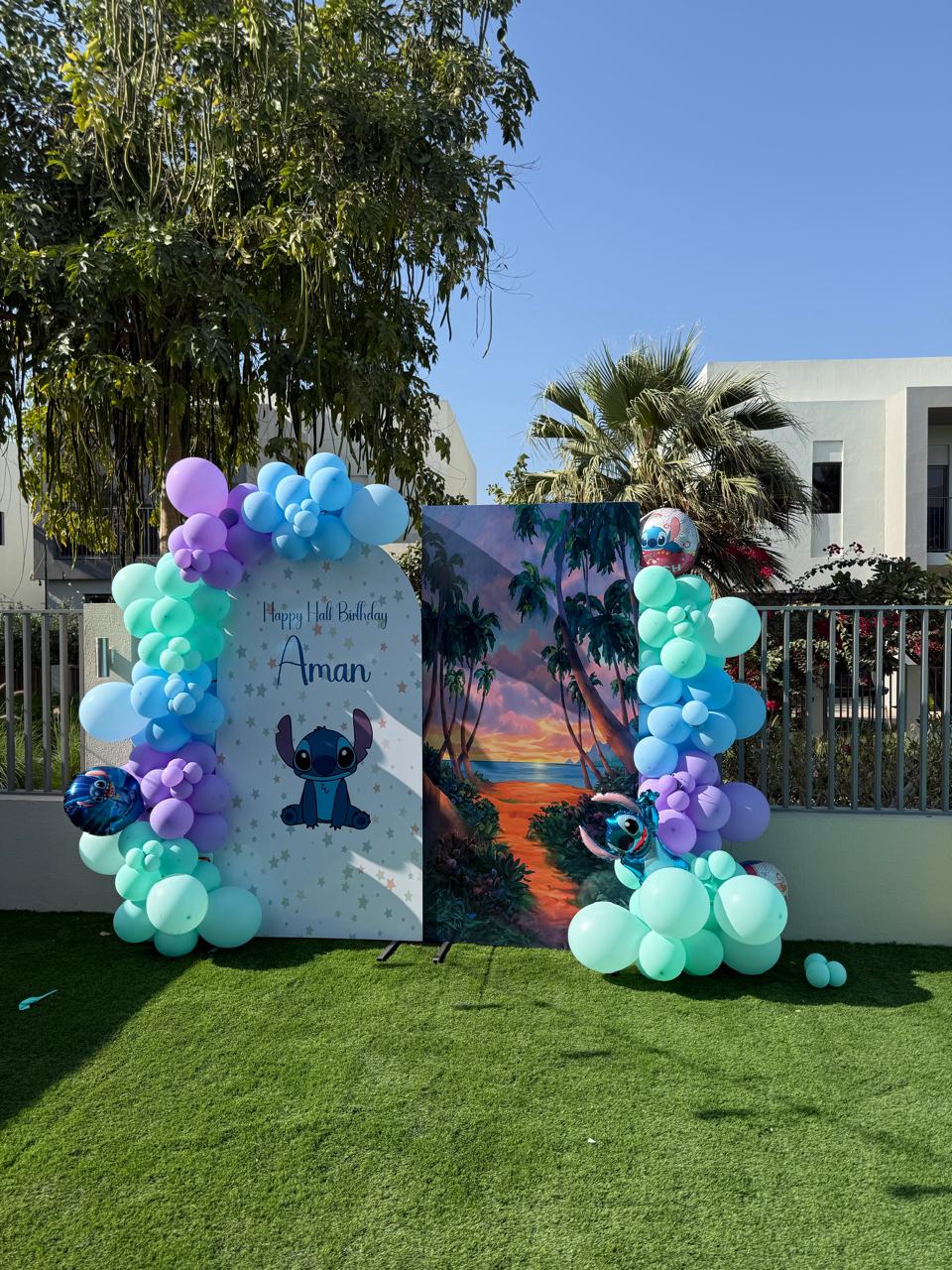 Theme birthday backdrop package with Stitch-inspired panels and balloon styling